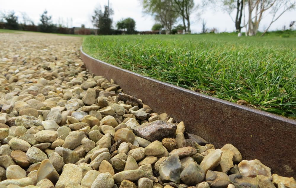 steel edging for retaining pebbles and gravel where it meets lawn