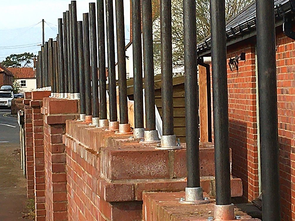 wall top woven fencing posts